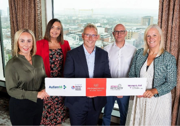 A group of people holding a banner
AI-generated content may be incorrect.