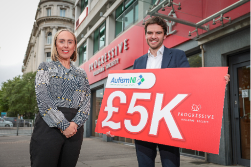 A person and person standing in front of a building holding a sign

AI-generated content may be incorrect.