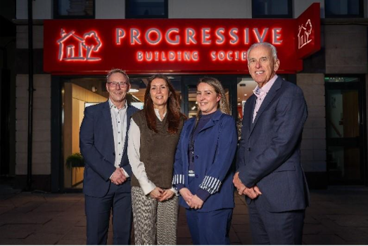 A group of people standing in front of a building

AI-generated content may be incorrect.